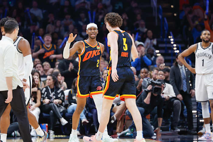 Dec 31, 2023; Oklahoma City, Oklahoma, USA; Oklahoma City Thunder guard Shai Gilgeous-Alexander (2) and Oklahoma City Thunder guard Josh Giddey (3) celebrate after a play against the Brooklyn Nets in the second half at Paycom Center.